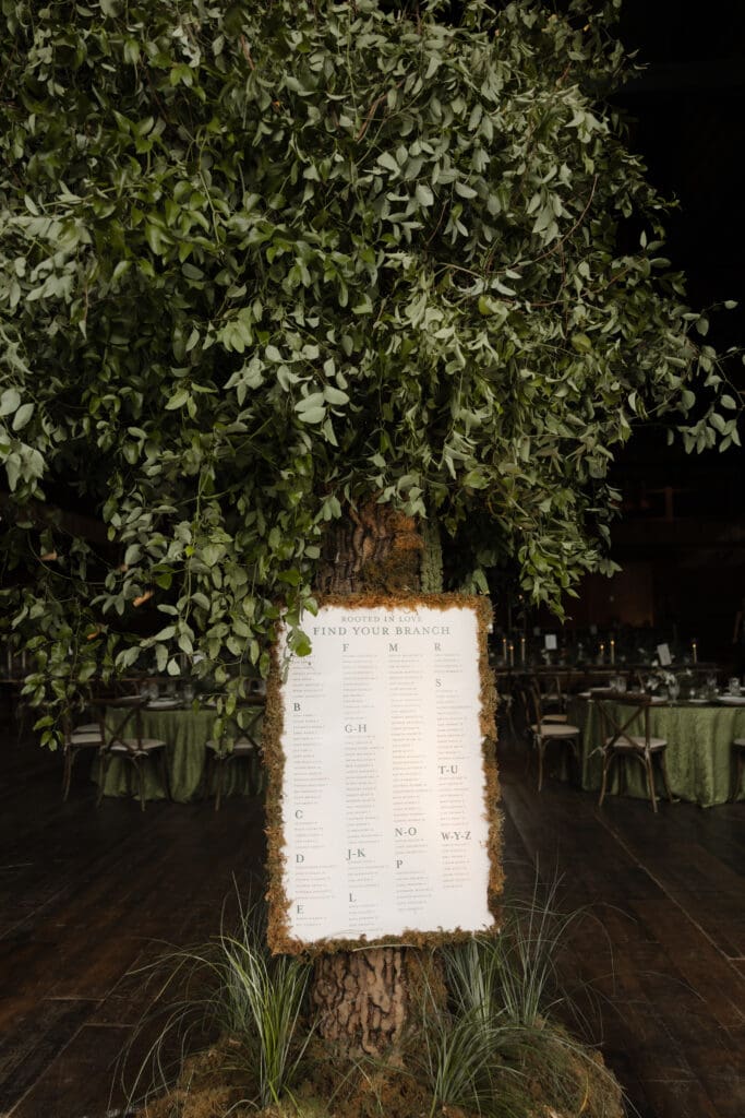Yellowstone Club Big Sky wedding seating chart designed as a 14-foot tree with “Rooted in Love, Find Your Branch” display