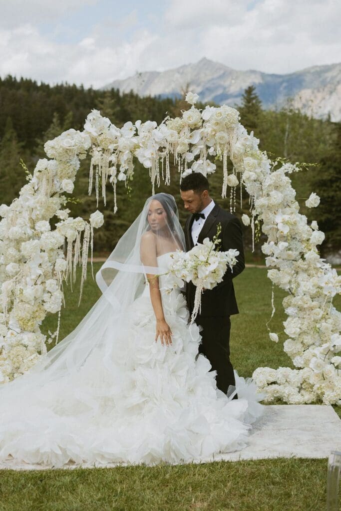 Luxe floral wedding arch in Montana mountain valley