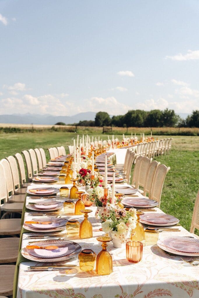 Wedding reception table winding through valley