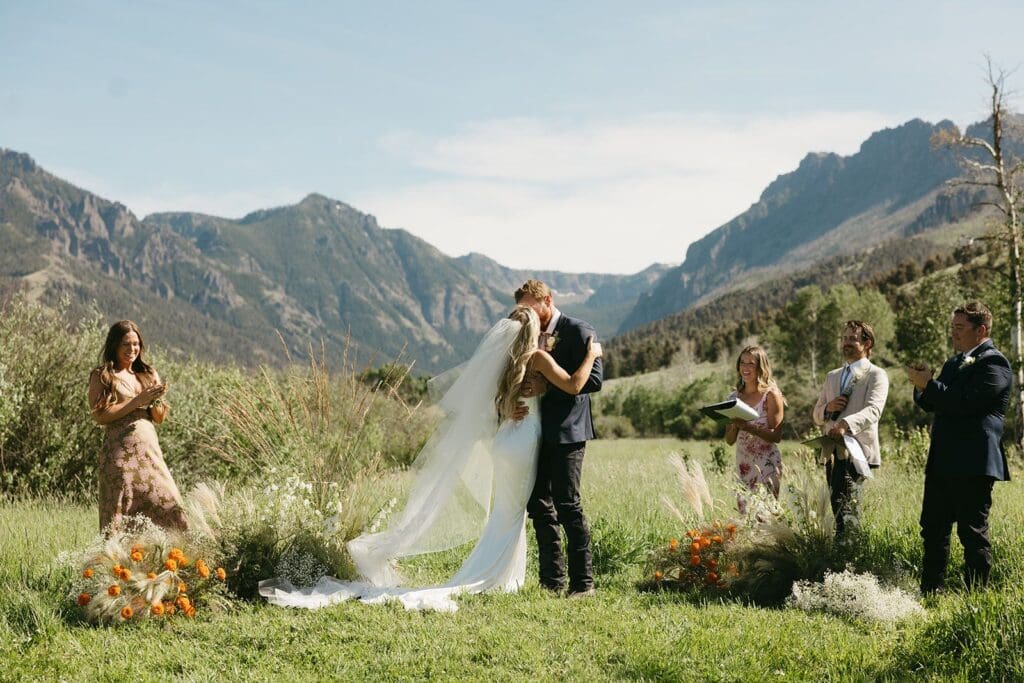 Wedding ceremony with Montana mountain skyline